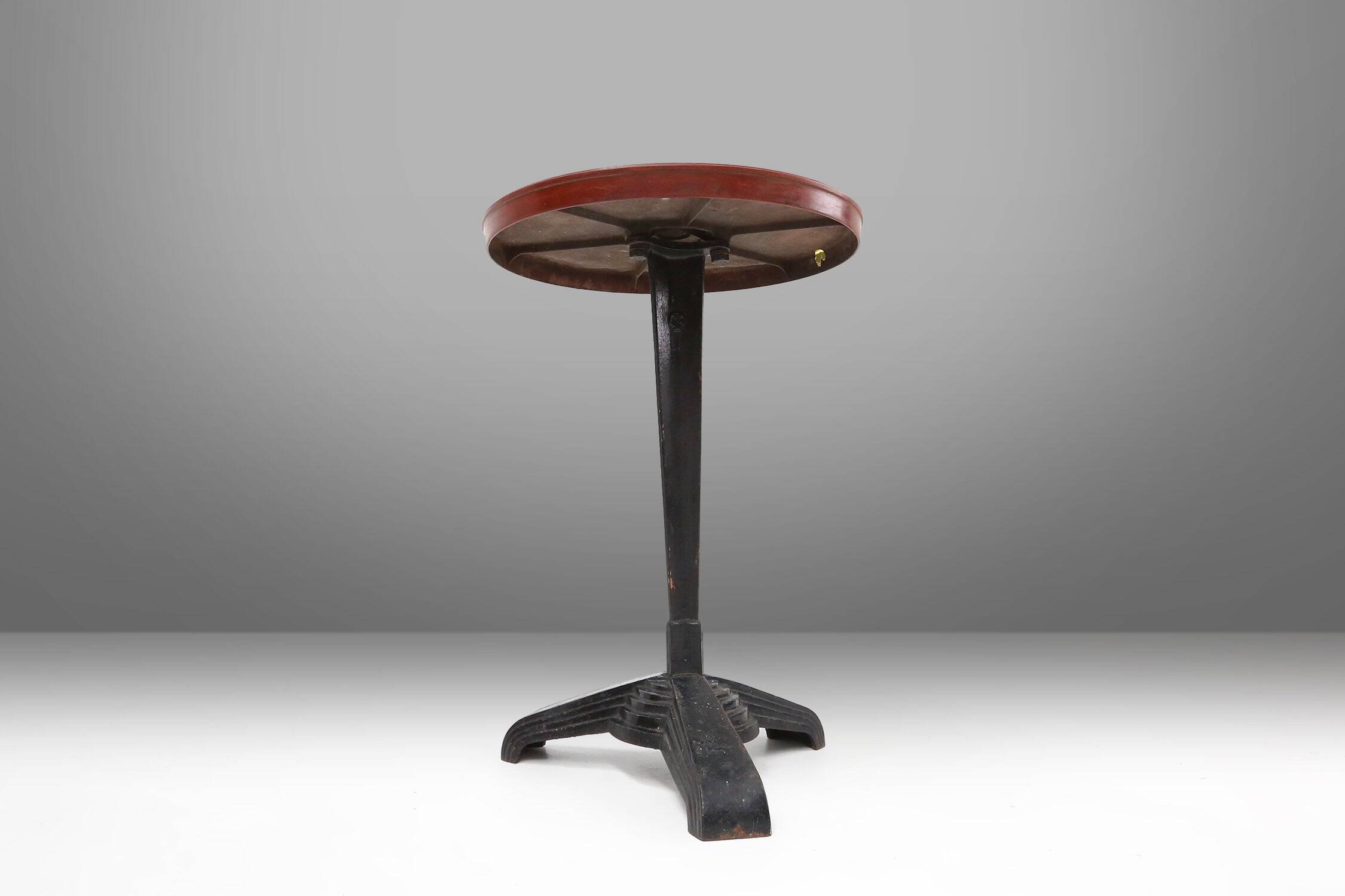 Cast Iron Bistro Table with Bakelite Top from Louis Vuitton, France, 1930s