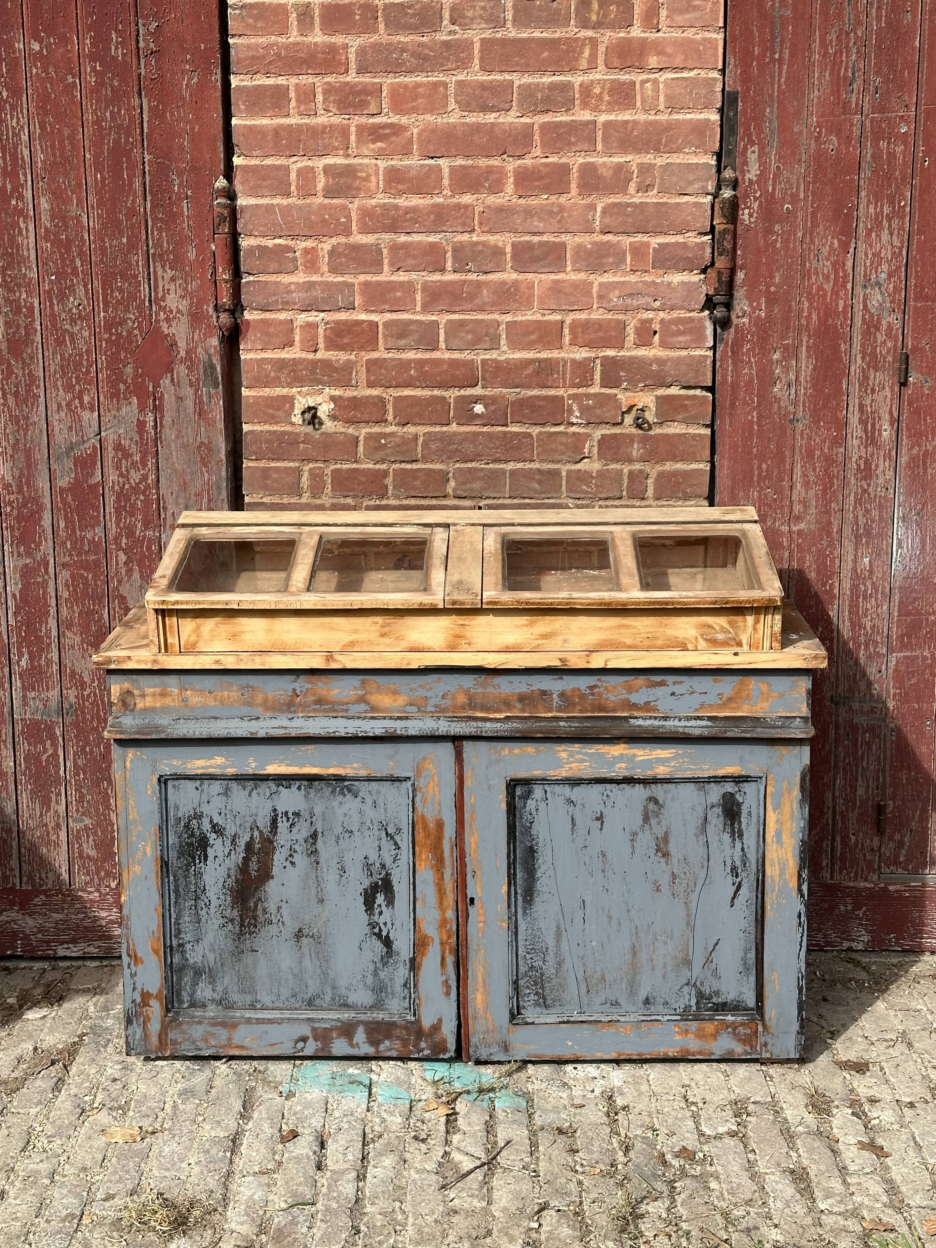 Showcase for boutique furniture, inclined boxes for presentation of collections on low sideboard