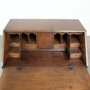 Antique English oak secretary from the 18th century with a stepped interior