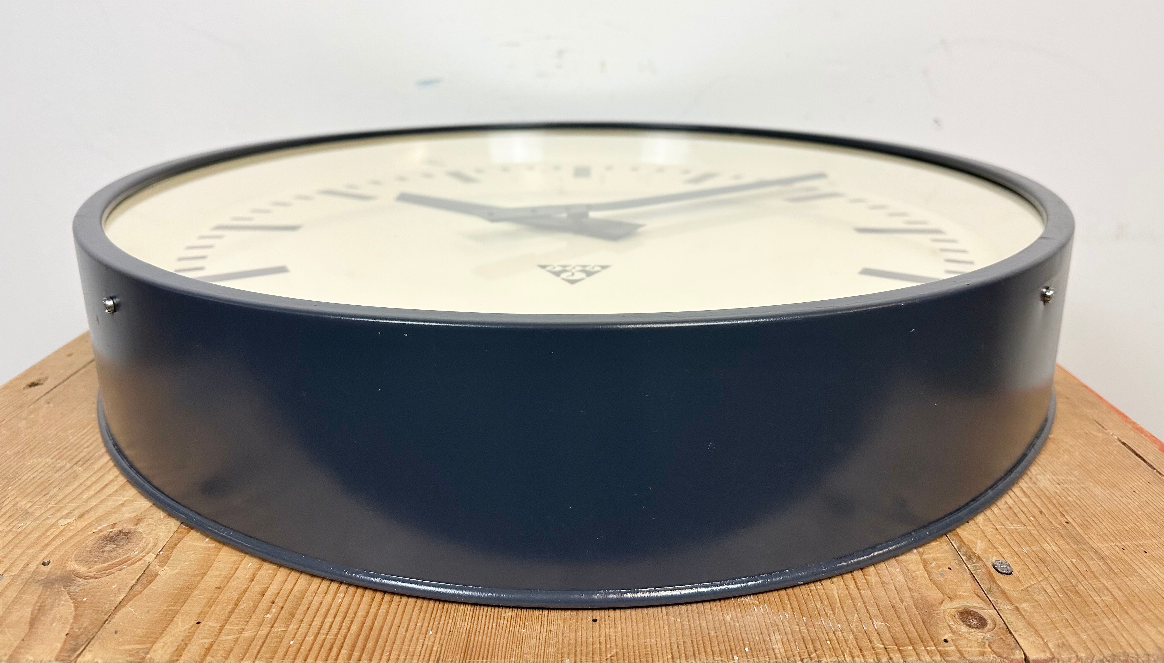 Grey industrial factory wall clock from pragotron, 1960s