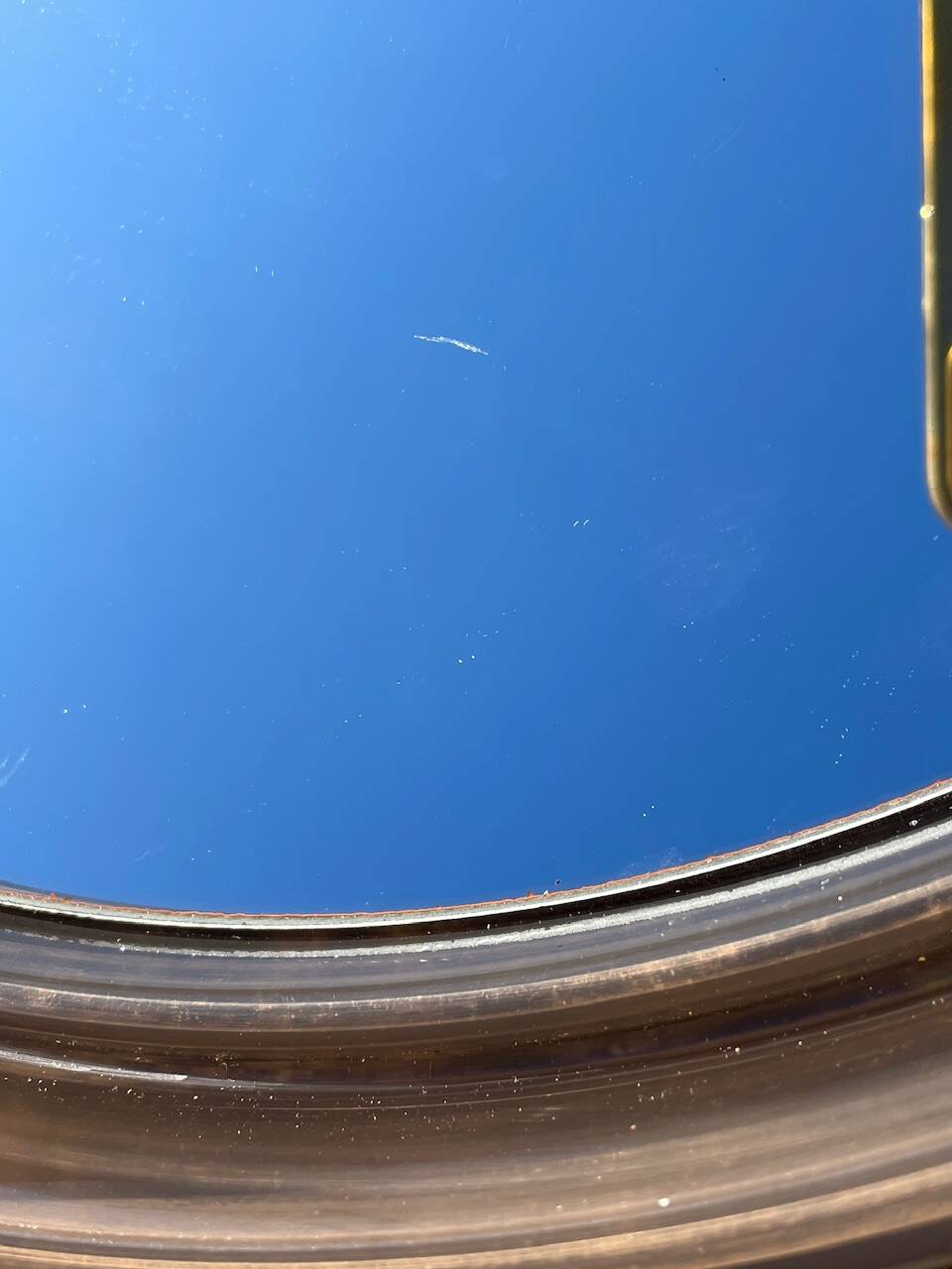 Vintage round smoked plastic mirror, circa 1970s.