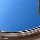 Vintage round smoked plastic mirror, circa 1970s.