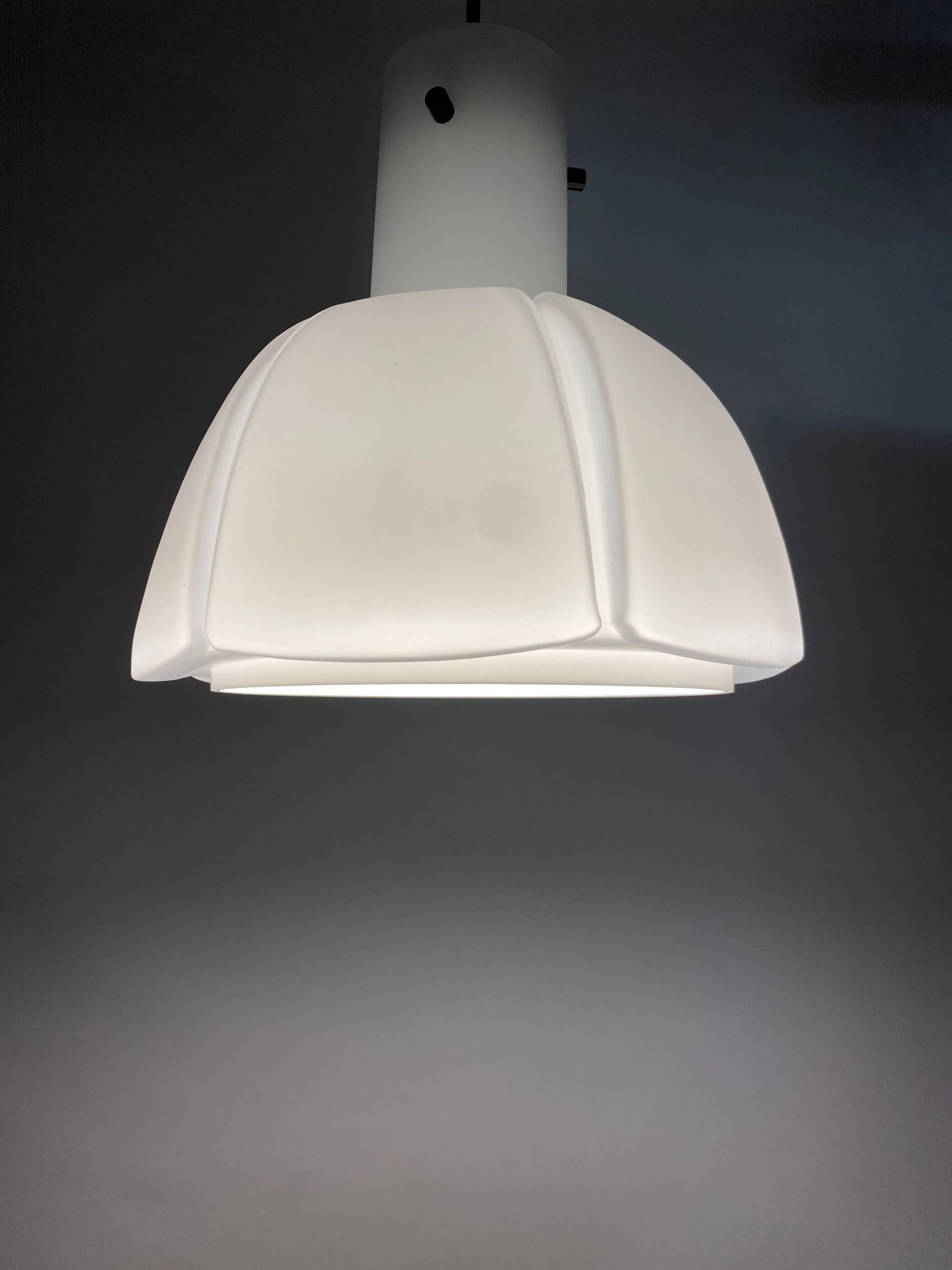 Frosted glass pendant in the shape of a white flower by Glashütte Limburg.