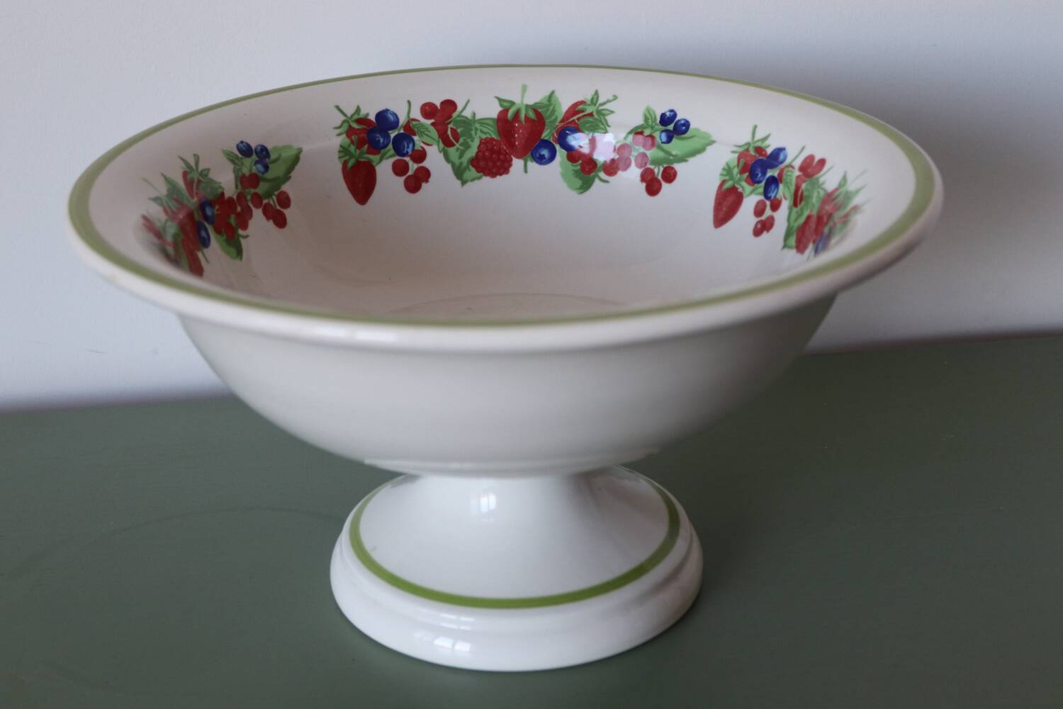 Large ceramic fruit bowl with red fruits