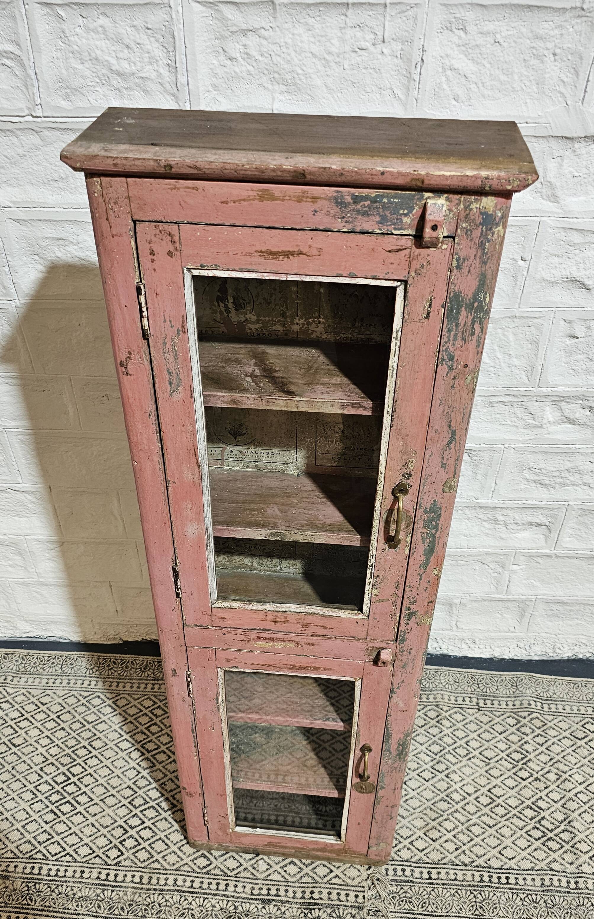 Pink showcase in Burmese teak
