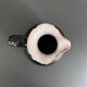 Antique black pitcher with white collar