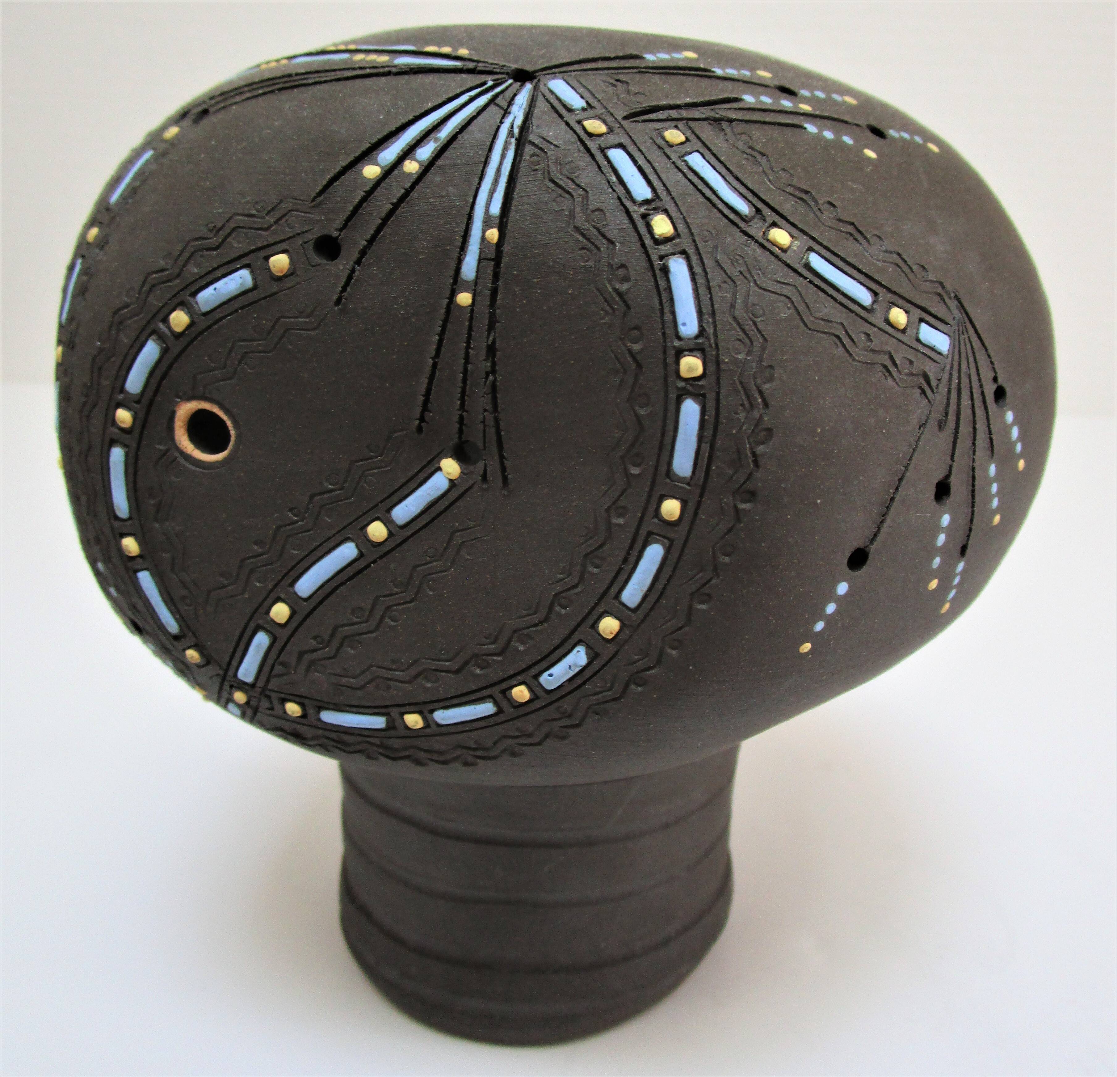 Anthropomorphic candle holder, scarified ceramic, stamped design