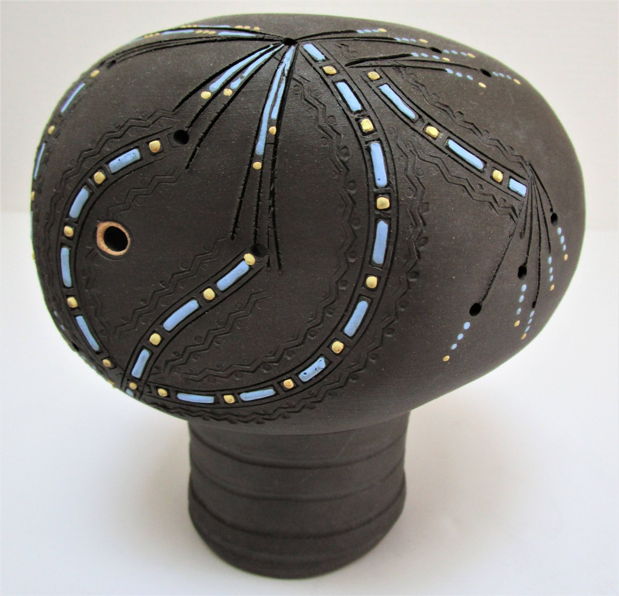 Anthropomorphic candle holder, scarified ceramic, stamped design