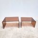 Pair of vintage smoked plexiglass nesting tables.