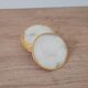 Set of 11 mother-of-pearl coasters with brass rim.