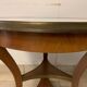 Empire-style tripode healing in mahogany top of marble gallery
