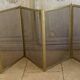Five-panel golden metal fireplace screen from the 19th century.