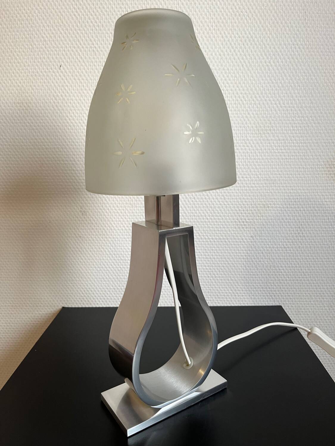 Metal foot lamp with thick glass lampshade