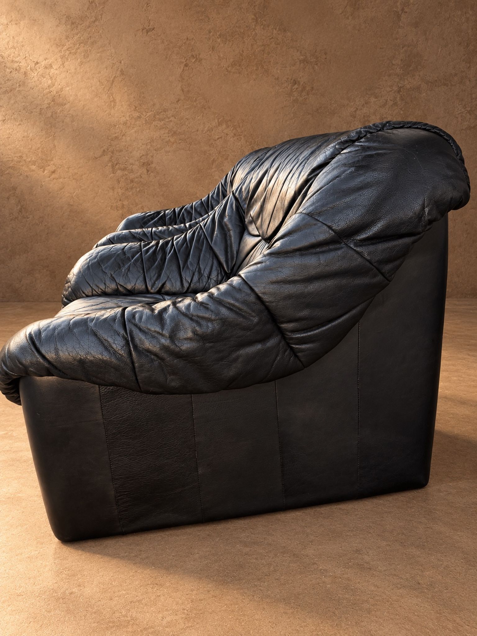 Leather armchairs and matching pouf, Italy, circa 1980