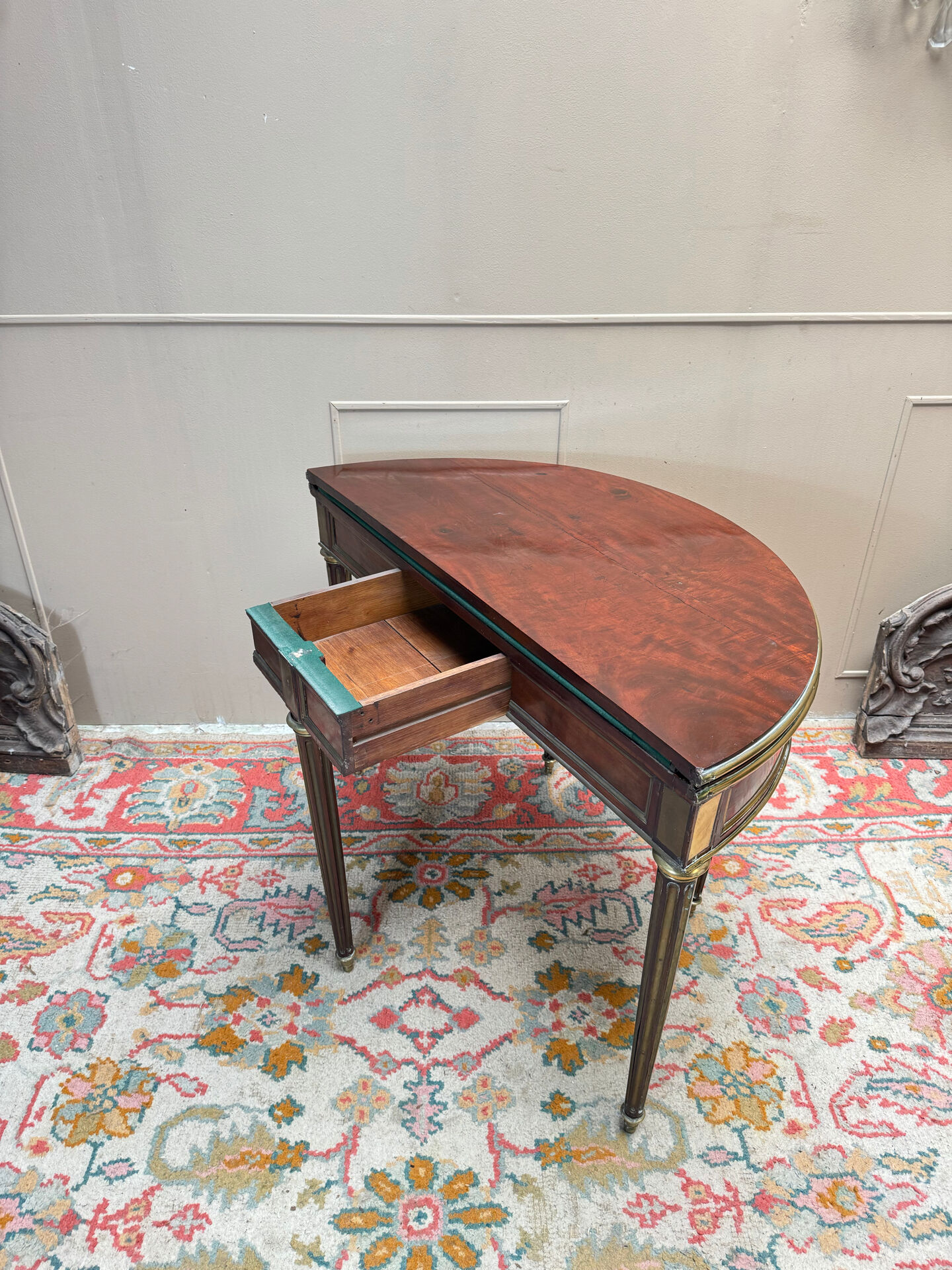 Half-moon table in mahogany from the Louis XVI period, 18th century.