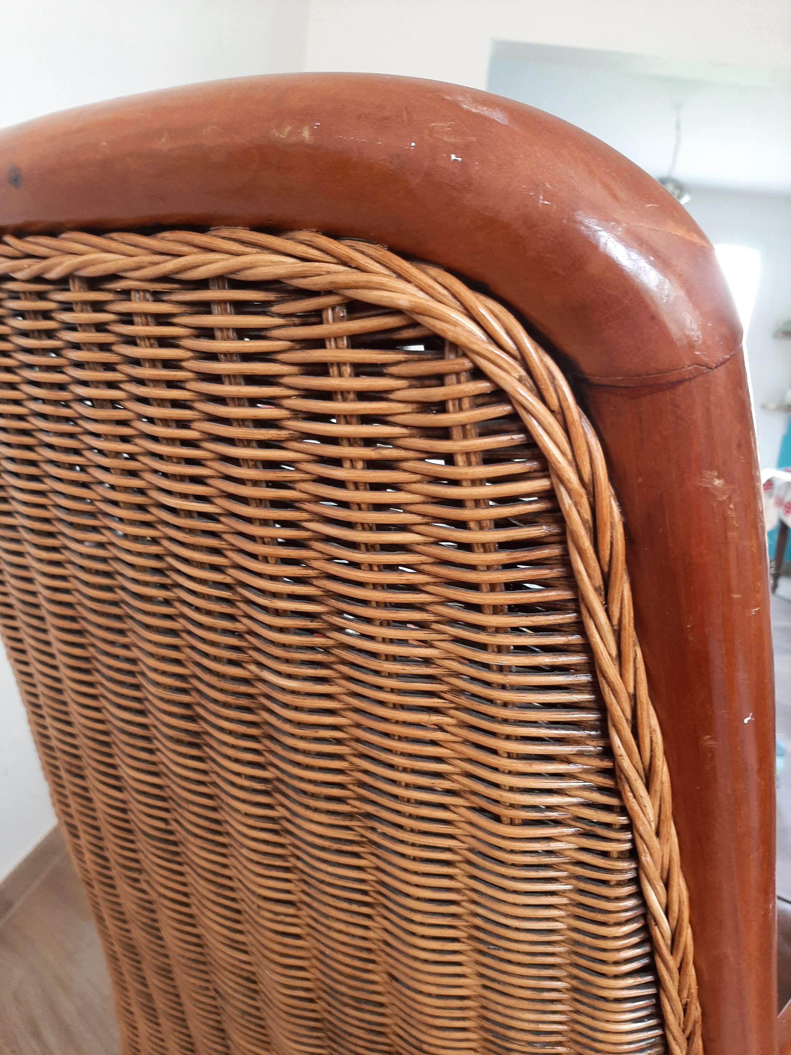 Armchair in woven rattan and exotic wood