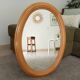 Vintage oval mirror in beech from the 70s/80s.