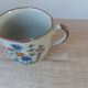 Set of two speckled stoneware mugs with small wildflower bohemian retro design.