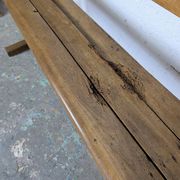 Double school desk and its wooden bench