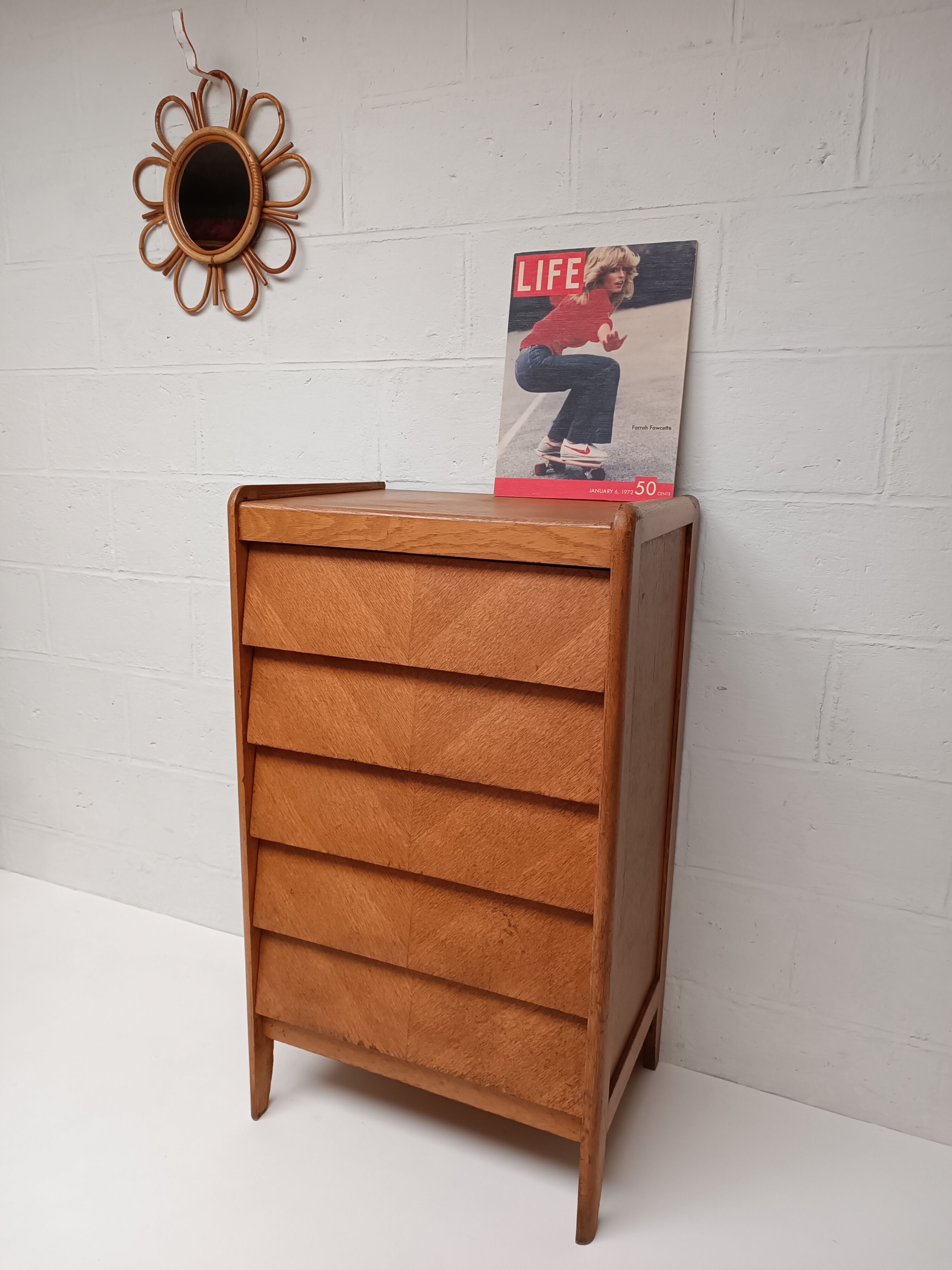 High wooden chest of drawers in the 50s