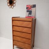 High wooden chest of drawers in the 50s