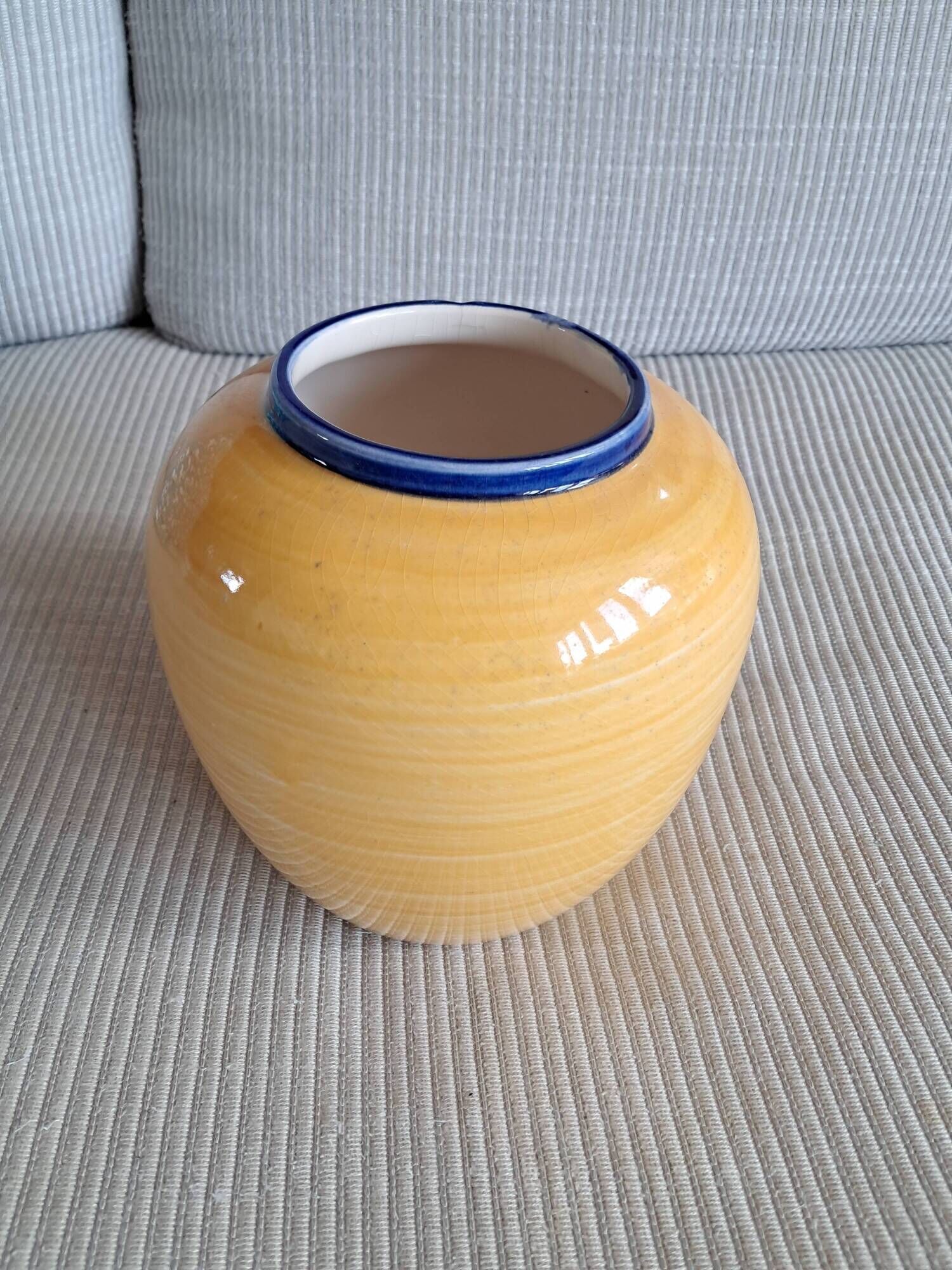 Vintage ceramic vase in a round shape.