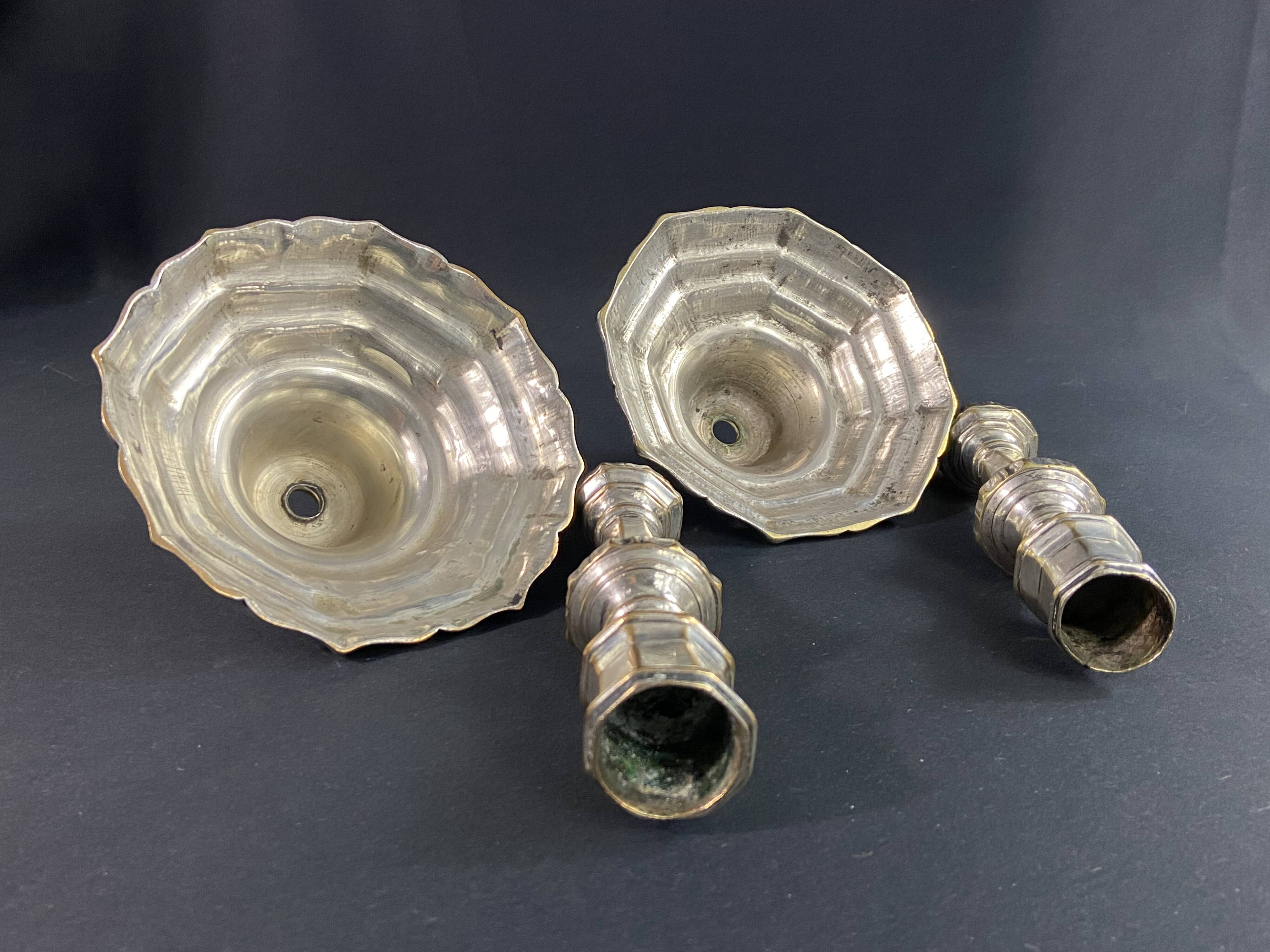 Pair of 18th century Regency candlesticks in silvered bronze