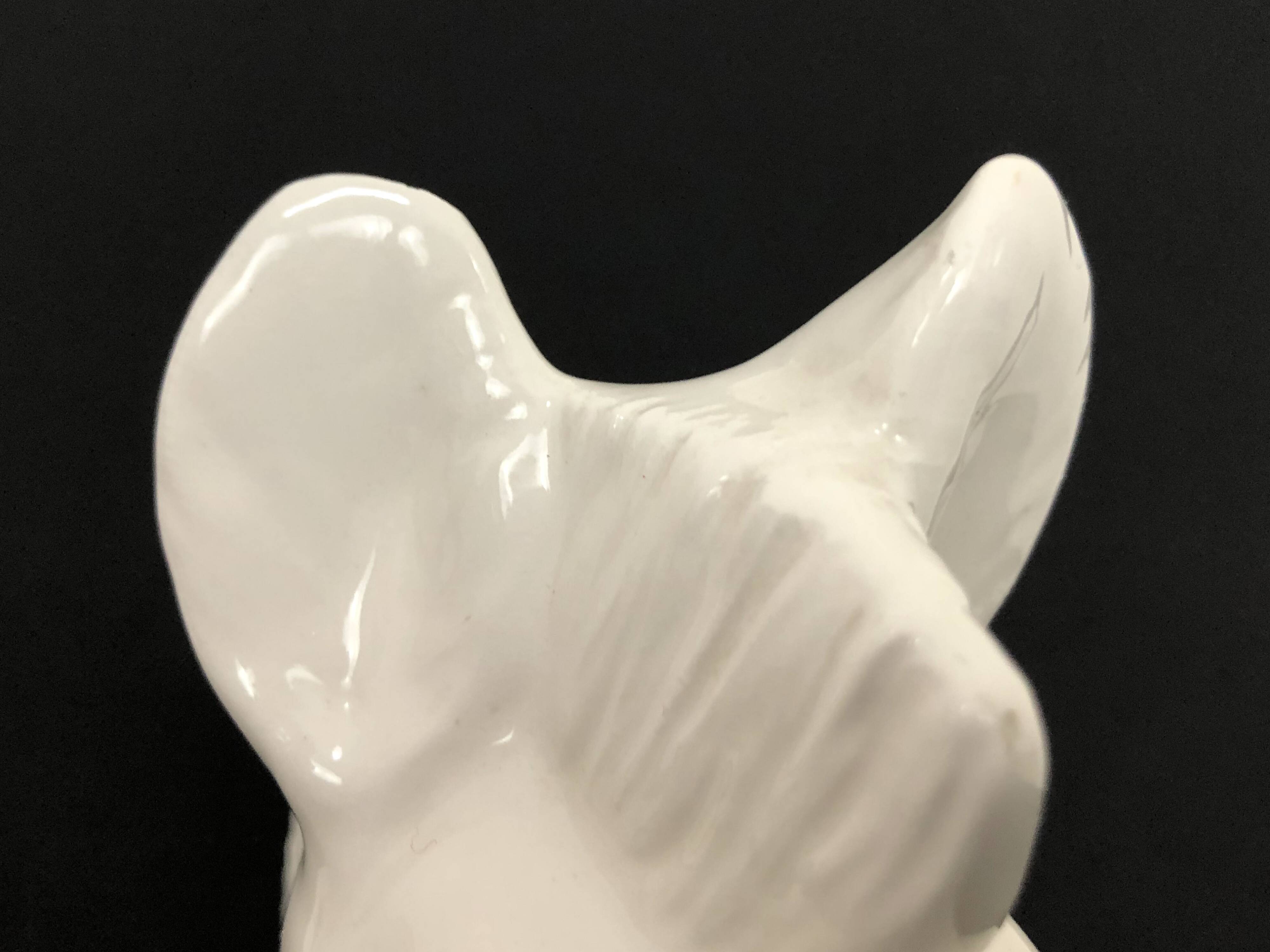 Pair of vintage white ceramic weighted horse bookends. 80 years