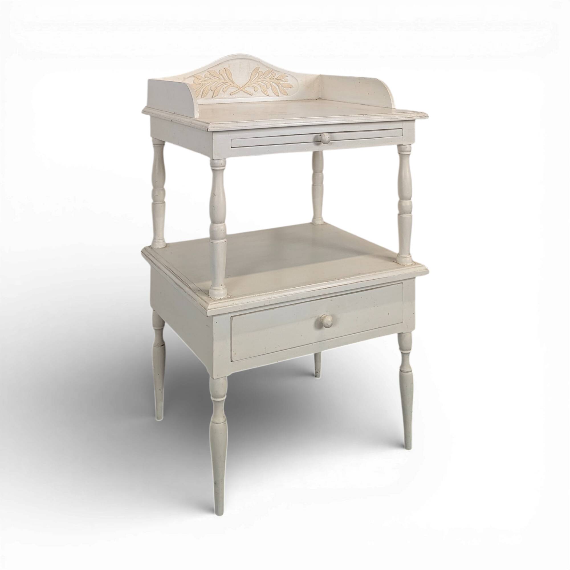 White side table with a painted finish.