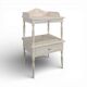 White side table with a painted finish.