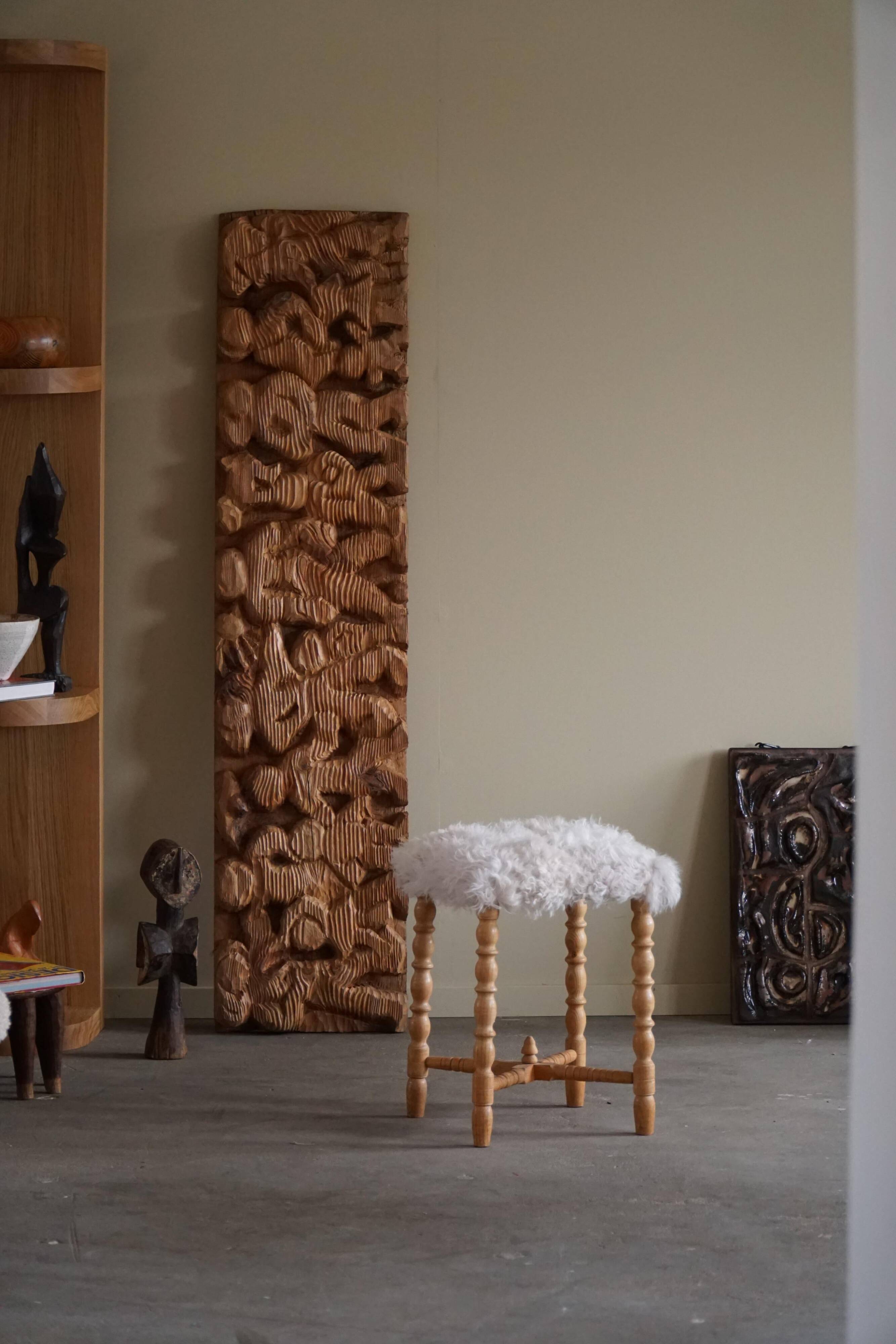 High oak stool, reupholstered in lambswool, Danish cabinetmaker, 1950s.