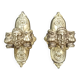 Pair of bronze wall sconces with mask, signed L. Pinet, Art Nouveau period.