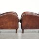 Dark cognac-coloured set of 2 sheepskin armchairs with a sleek design