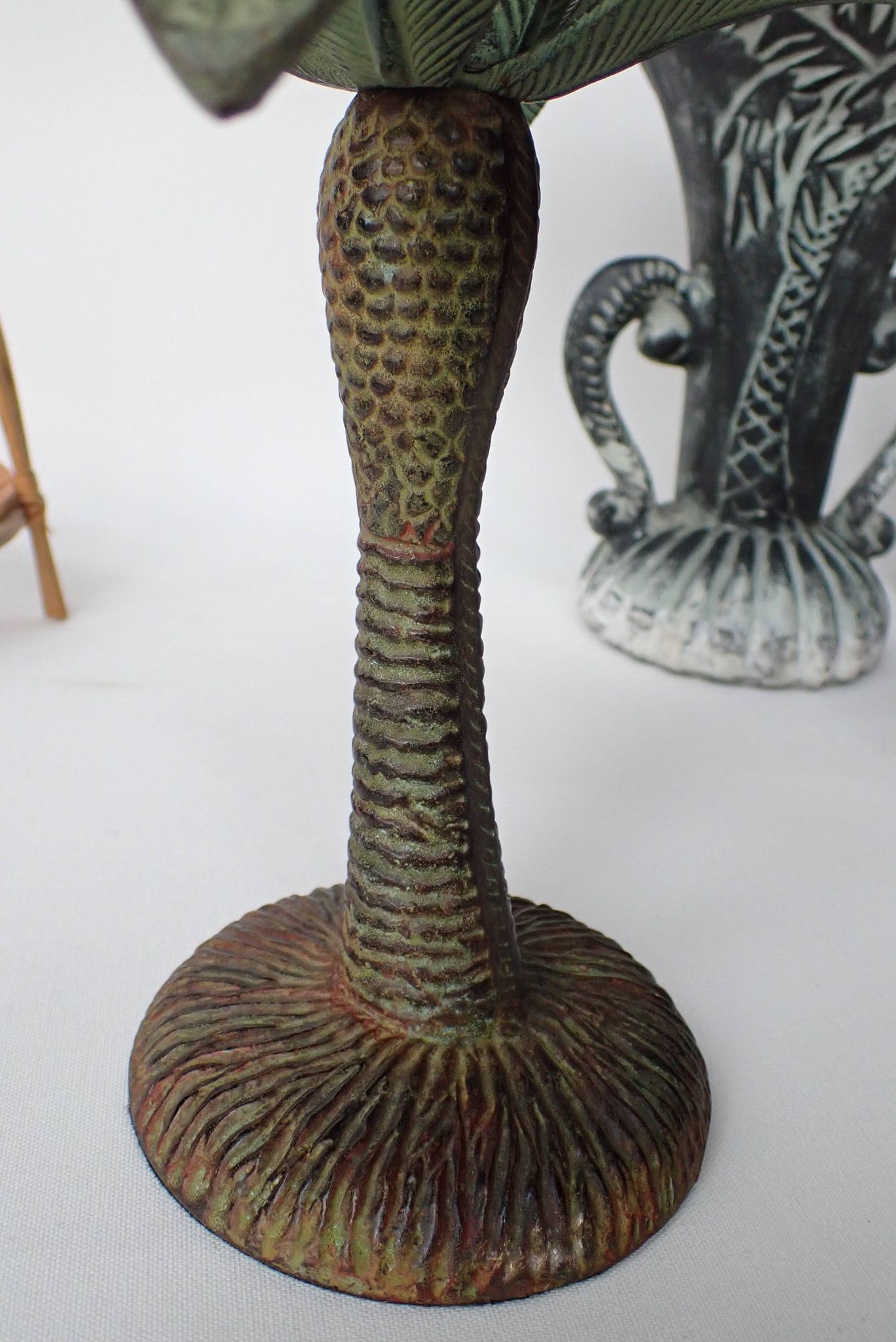 Antique palm tree-shaped candlestick in patinated metal