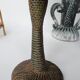 Antique palm tree-shaped candlestick in patinated metal