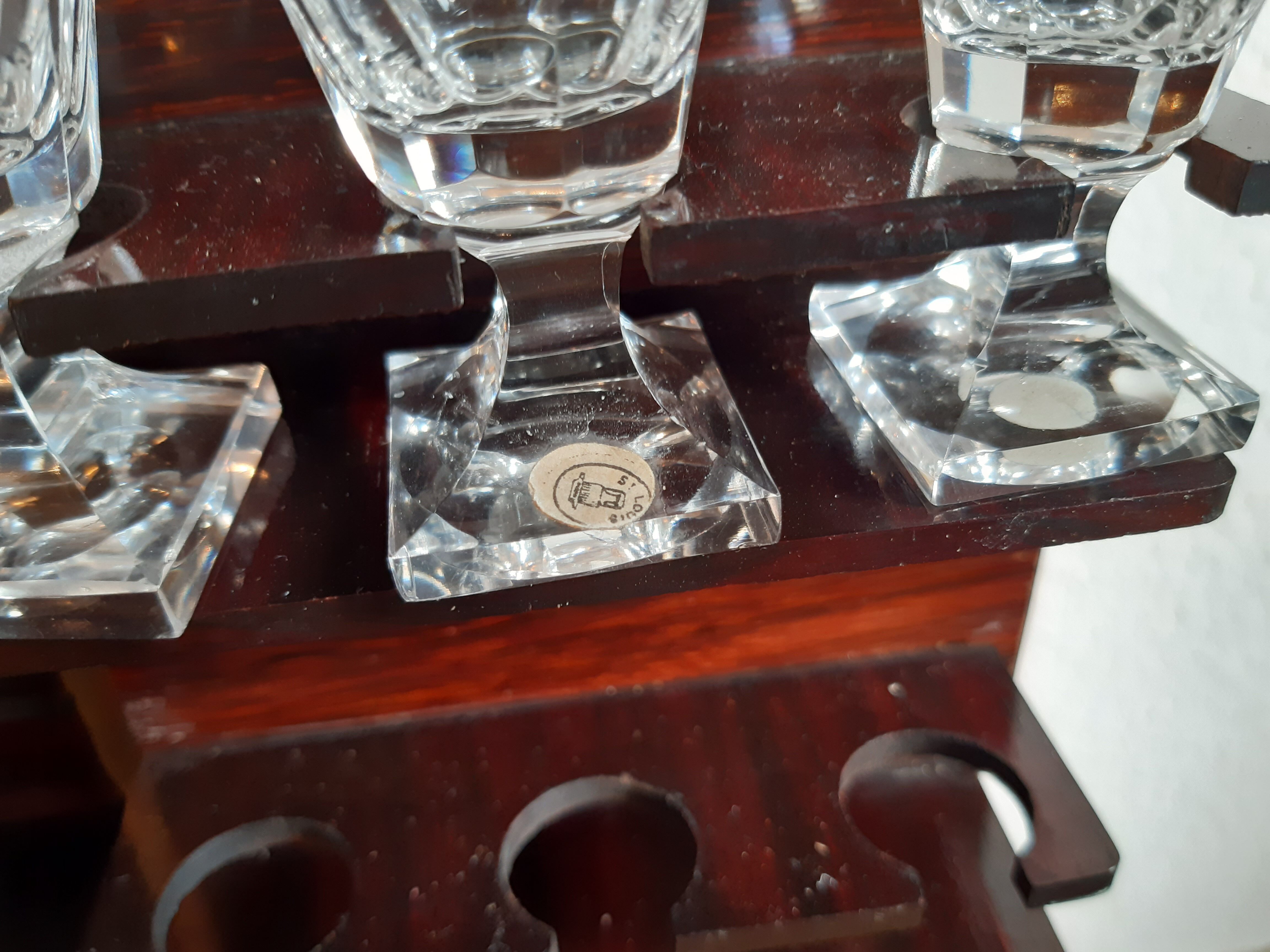 Old-fashioned glass liquor cellar and St Louis crystal decanters