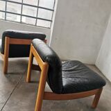 Pair of designer leather armchairs 80s