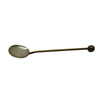 Ancient silver metal spoon and vintage brass
