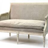 Louis XVI style canapé, in white lacquered wood.