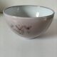 Glazed earthenware bowl, Millian pottery, France, stylised floral decoration.