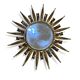 Golden and patinated metal sun mirror