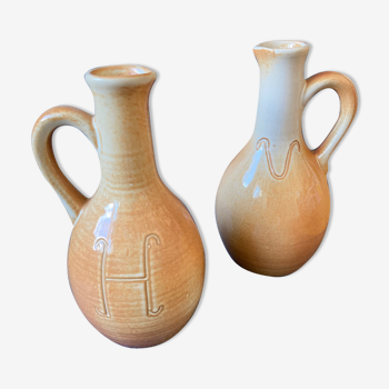 Bottles of beige sandstone varnished Oil and Vinegar