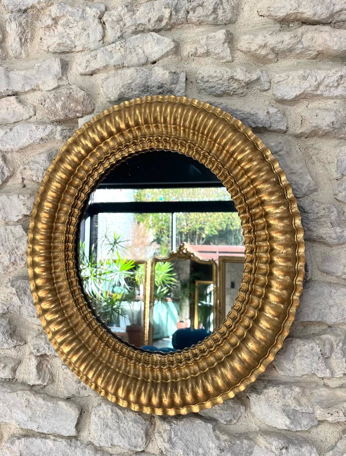 Pair of antique oval mirrors gilded with gold leaf and mercury.