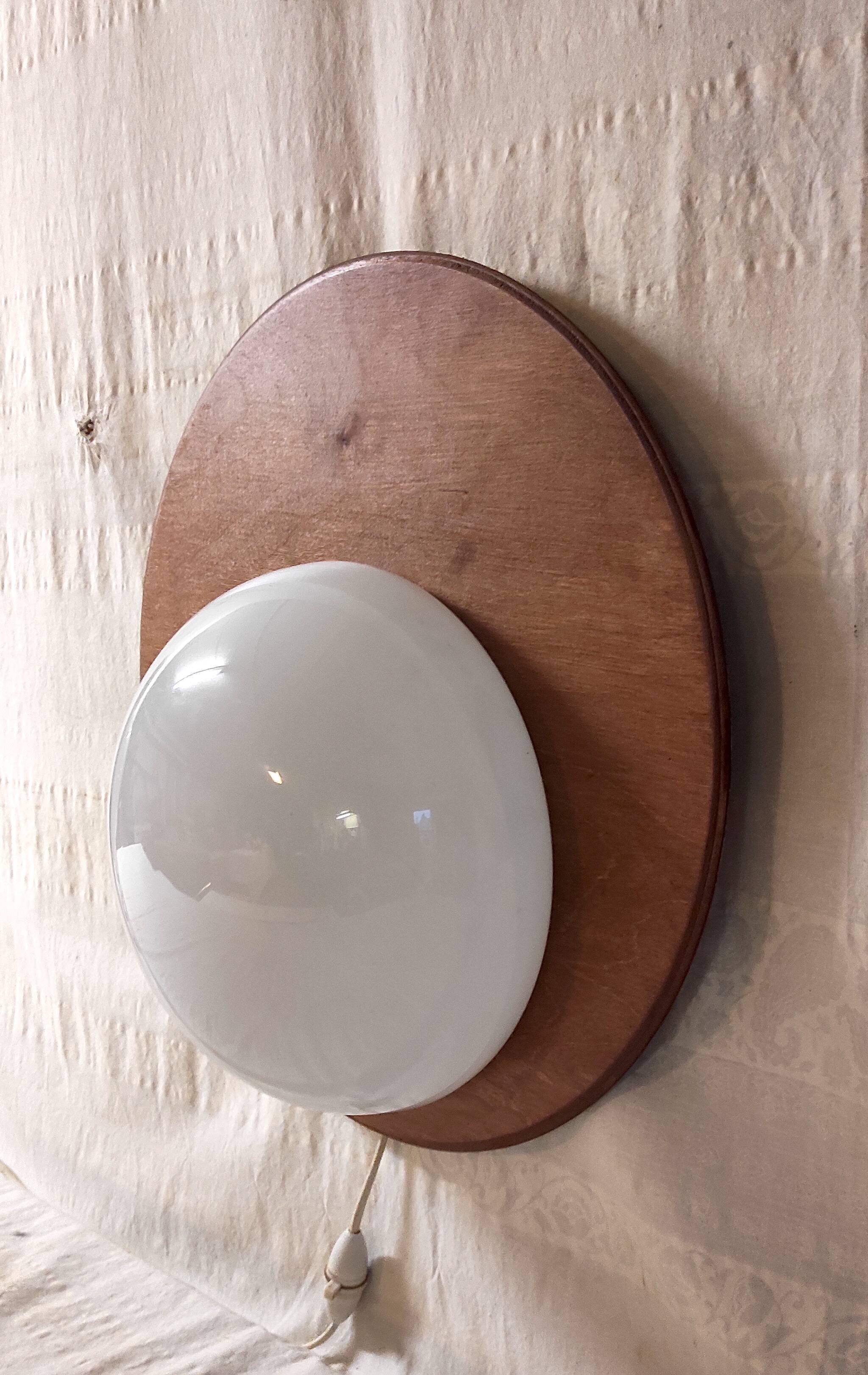 Designer wall lights in wood and opaline globe - mid-20th century
