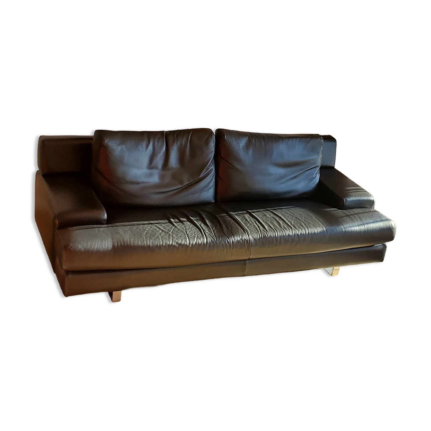 Black leather three-seater sofa