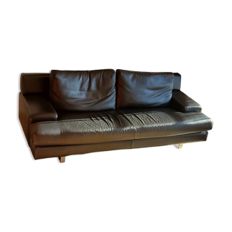 Black leather three-seater sofa
