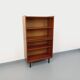Vintage wooden bookshelf in teak style from the 1960s.