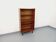 Vintage wooden bookshelf in teak style from the 1960s.