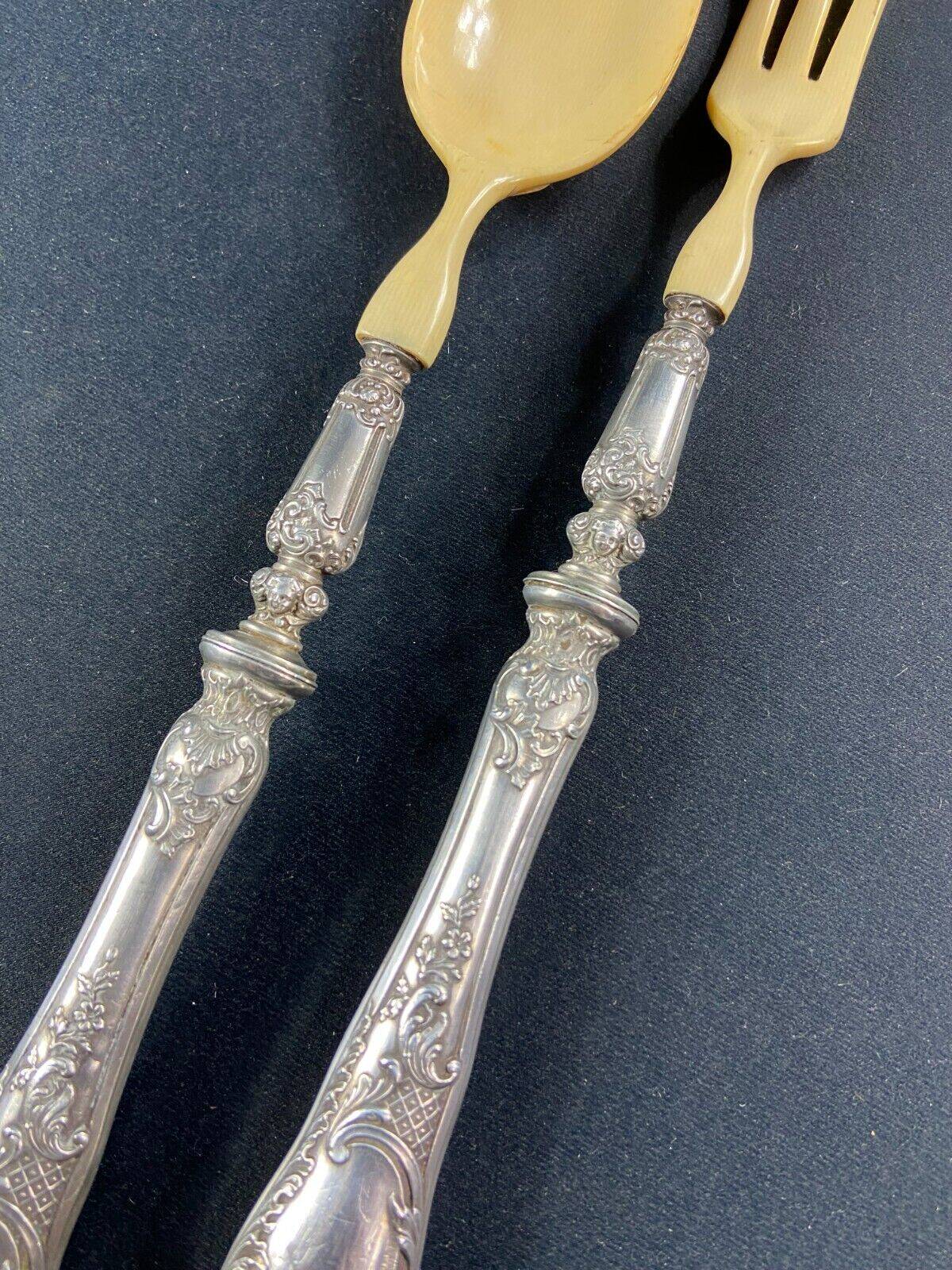 Salad service silver handles Regency decoration with cherub heads
