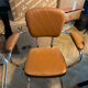 Armchair with armrests from the 70s in Skai and chrome.